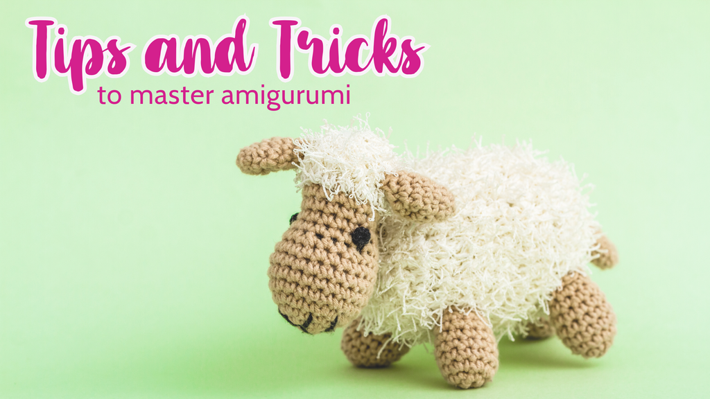 Crochet lamb stuffie on a green background with text that reads Tips and Tricks to master amigurumi