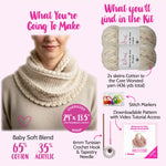 Knitted wrap with KnitPal Cotton to the Core yarn and knitting tools on a pink background