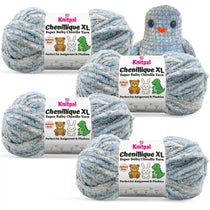 KnitPal Chenillique XL super bulky chenille yarn in Blue Whisper blue and gray colorway, four skeins with crochet bird plushie.