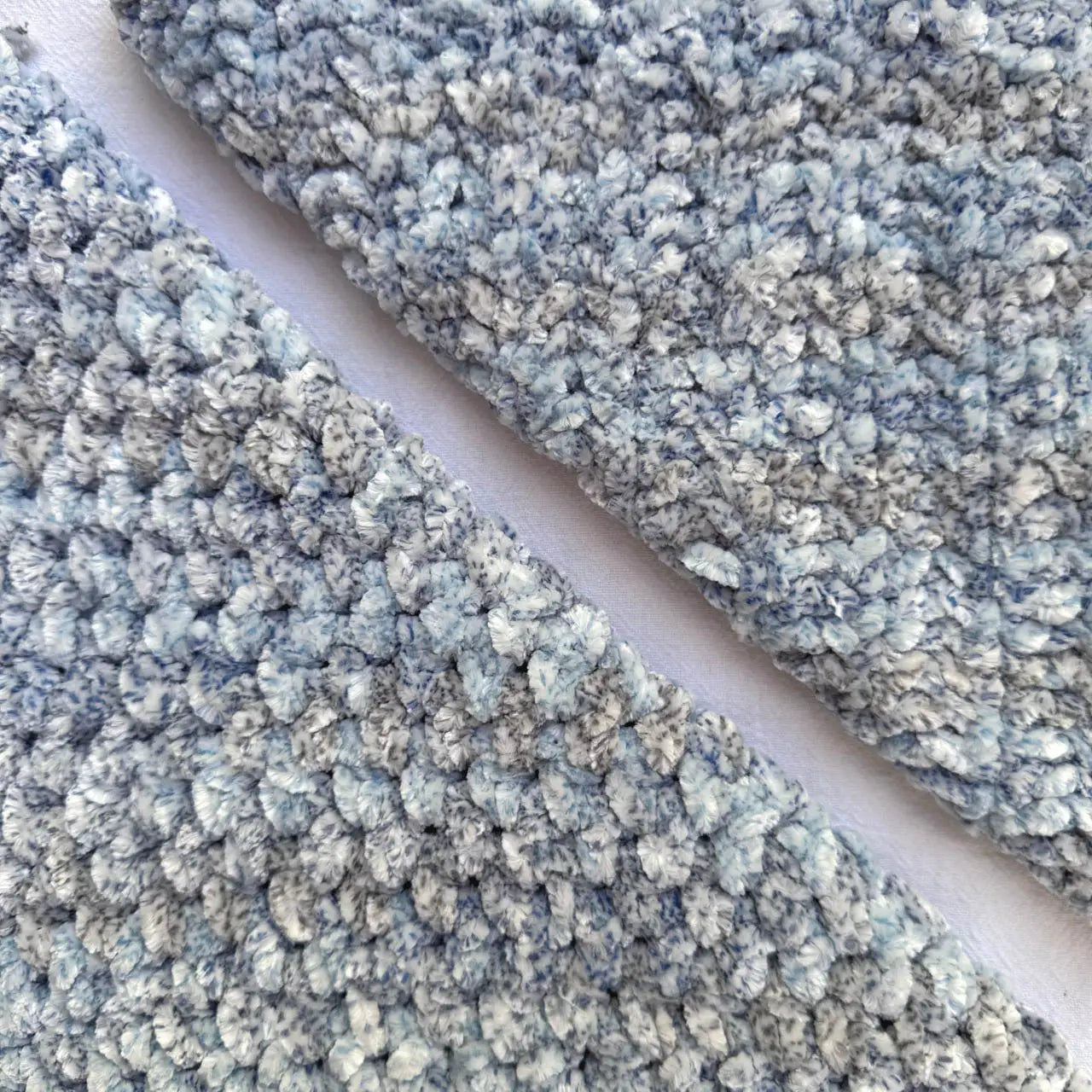 KnitPal Chenillique XL chenille yarn in Blue Whisper, close-up swatch half knit half crochet showing plush blue-gray texture.