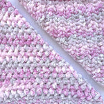 KnitPal Chenillique XL chenille yarn in Dusky Rose, close-up swatch half knit half crochet showing plush pink-and-gray texture.