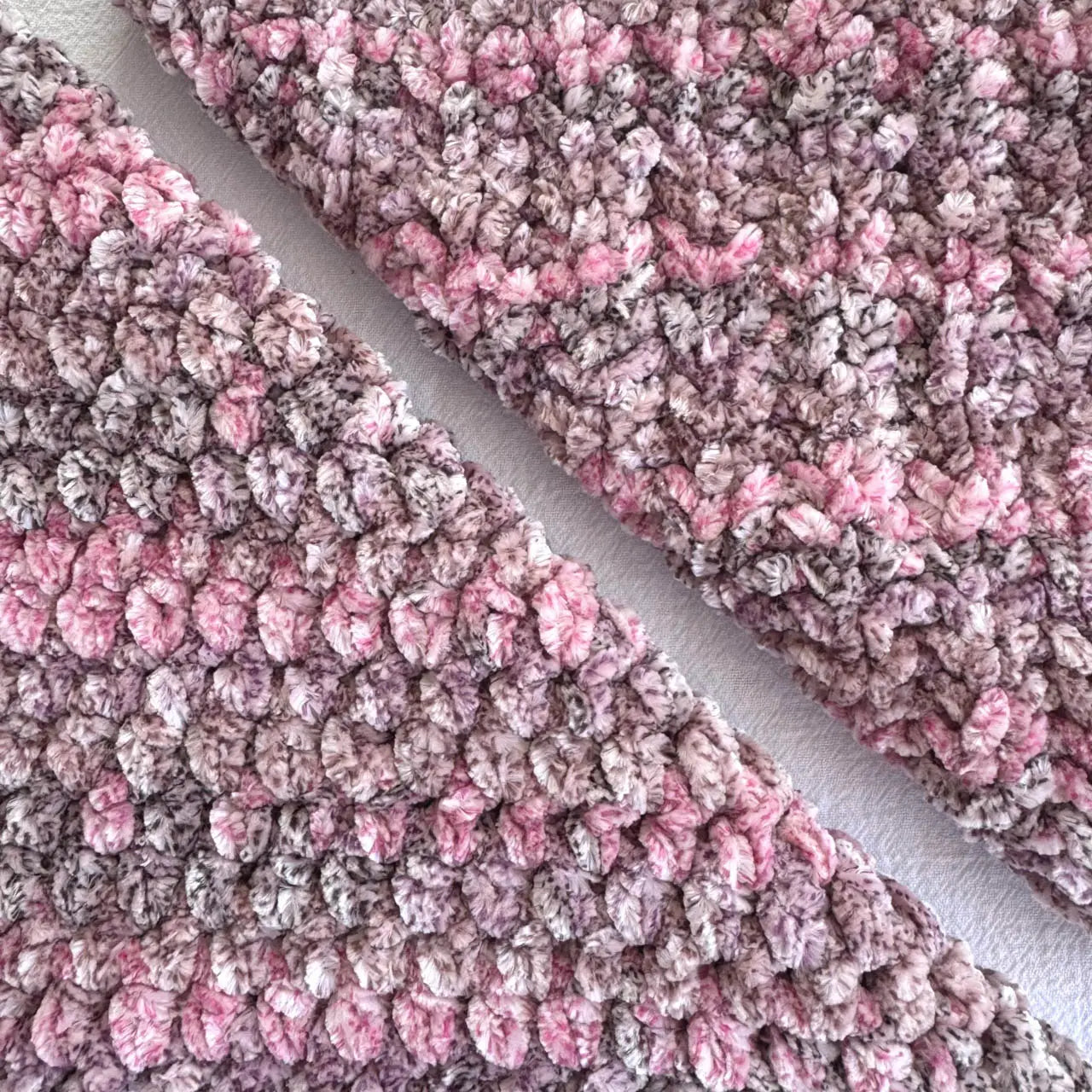 KnitPal Chenillique XL chenille yarn in Enchanted Berry, close-up swatch half knit half crochet showing plush speckled pink-mauve texture.