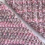 KnitPal Chenillique XL chenille yarn in Enchanted Berry, close-up swatch half knit half crochet showing plush speckled pink-mauve texture.