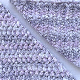 KnitPal Chenillique XL chenille yarn in Lavender Bliss, close-up swatch half knit half crochet showing plush speckled lavender texture.