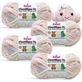 KnitPal Chenillique XL super bulky chenille yarn in Pastel Dreams pink, blue, and cream colorway, four skeins with amigurumi crochet cloud plushie.