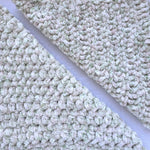 KnitPal Chenillique XL chenille yarn in Spring Haze, close-up swatch half knit half crochet showing plush cream and green speckled texture.