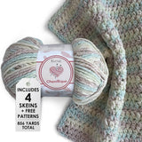 KnitPal Chenillique yarn in Beach Sand colorway, worsted weight 100% polyester chenille cake with label, styled with knitted swatch