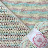 KnitPal Chenillique Beach Sand chenille yarn swatch showing knit and crochet texture side by side in soft mint, cream, and blush tones