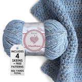 KnitPal Chenillique yarn in Blueberry Whisper colorway, worsted weight 100% polyester chenille cake with label, styled with knitted swatch