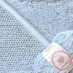 KnitPal Chenillique Frosted Blue chenille yarn swatch showing knit and crochet texture side by side in soft icy silver-blue