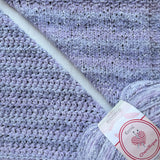 KnitPal Chenillique Lavender Bliss chenille yarn swatch showing knit and crochet texture side by side in soft heathered periwinkle lavender