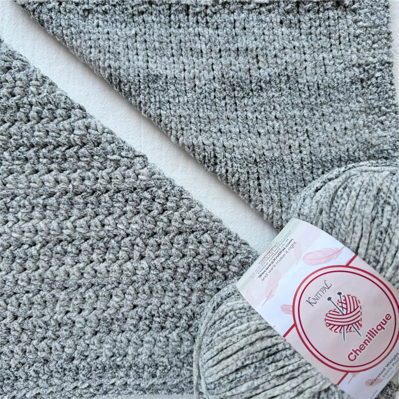 KnitPal Chenillique Ocean Mist chenille yarn swatch showing knit and crochet texture side by side in cool heathered gray with dark flecks