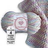 KnitPal Chenillique yarn in Pastel Dreams colorway, worsted weight 100% polyester chenille cake with label, styled with knitted swatch