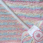 KnitPal Chenillique Pastel Dreams chenille yarn swatch showing knit and crochet texture side by side in variegated pink, blue, and cream