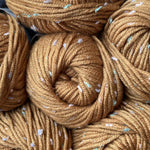 Close up of Golden Brown Tweed Twinkles KnitPal yarn showing the smooth, soft texture of the acrylic and polyester blend yarn.