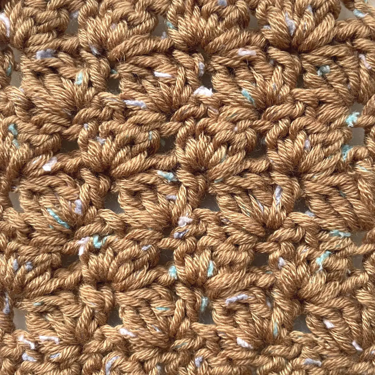 Crocheted swatch of KnitPal Tweed Twinkles Yarn in Golden Brown.