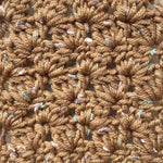 Crocheted swatch of KnitPal Tweed Twinkles Yarn in Golden Brown.