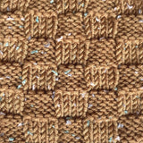 Knitted swatch in Golden Brown of Tweed Twinkles KnitPal Yarn. Basketweave knit stitch shows the tweed flecks in this buttery-soft yarn that is perfect for baby projects and so much more.