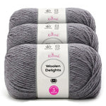 Three skeins of Knitpal Woolen Delights yarn in a heathered medium gray color, stacked vertically with white paper labels showing product details.