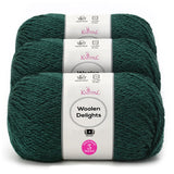 Three skeins of Knitpal Woolen Delights yarn in a deep forest green color, stacked together with white paper labels showing product details.